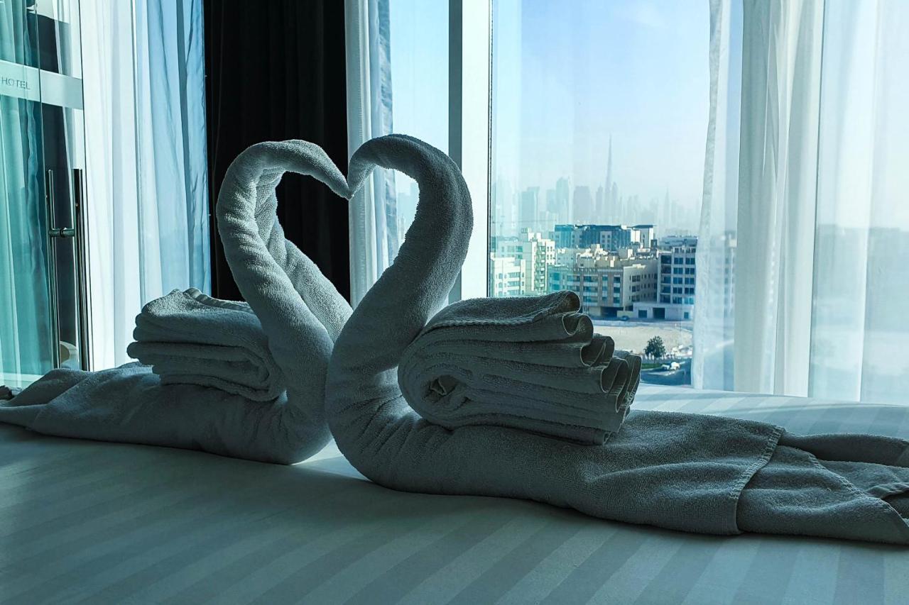 เดอะ แคนวาส โฮเต็ล ดูไบ - เอ็มแกลเลอรี Hotel ภายนอก รูปภาพ Towel swans
